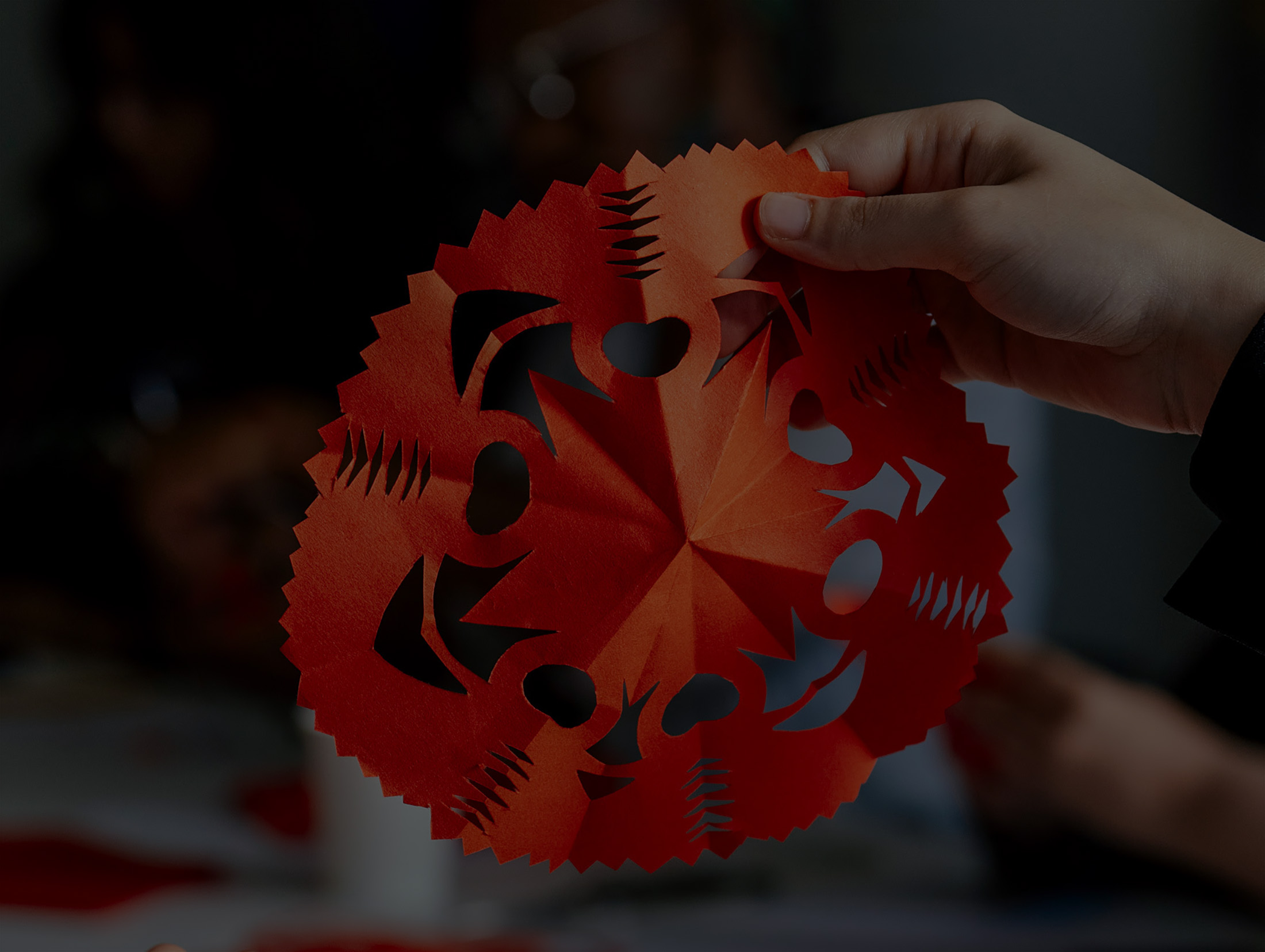 A woman placing her hand at the interactive installation.