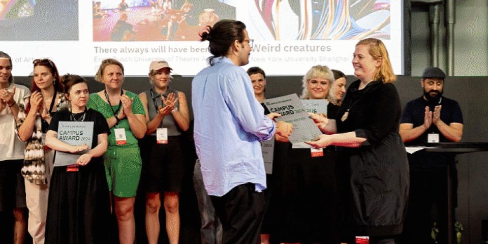 IMA professor receiving an award