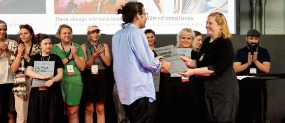 IMA professor receiving an award