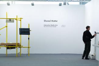 White wall with the text Shared Matter on it