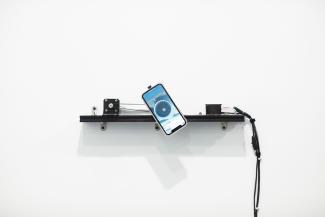 A phone suspended on the wall