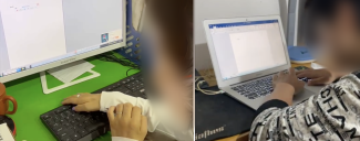 A person using a keyboard and another person using a Macbook Air