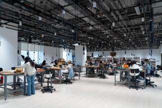 Students at their desks in a studio