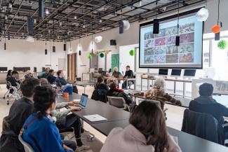 A group of students attending a talk in a studio