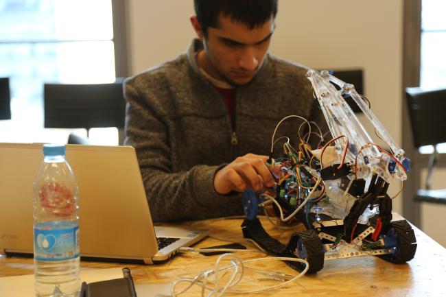 A student working on a robotics project