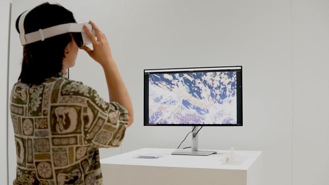 An audience member immerses themselves in the experience