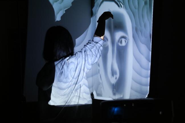 The distance between two hands is controlling another world