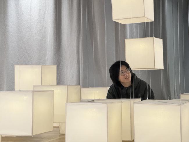 Yuhan Wang sitting inside FLOAT