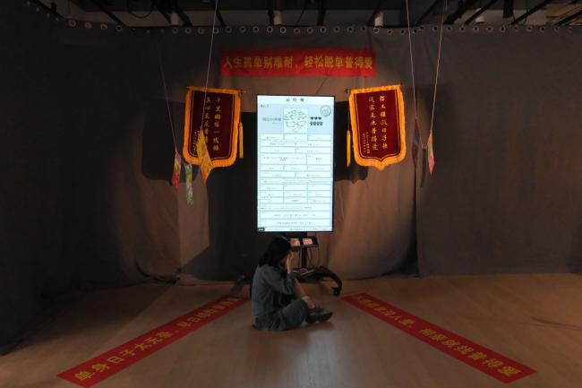 Exhibition installation view with audience.