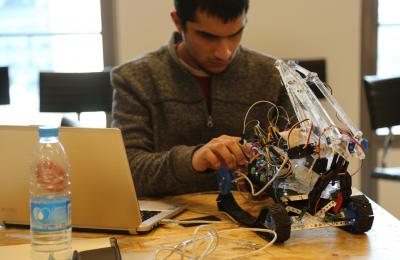 A student working on a robotics project
