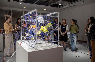 students presenting works in gallery